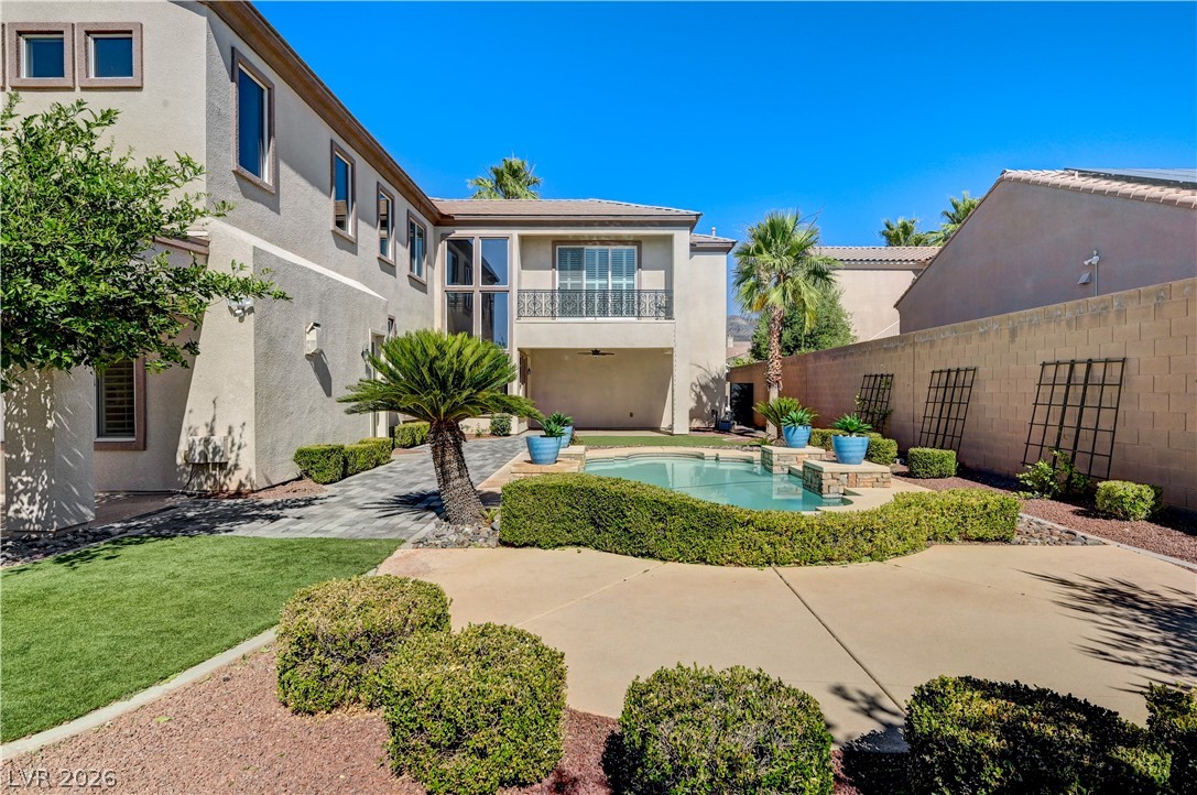 2793 Rosenhearty Drive Henderson, NV 89044 - Photo 62 of 77 Enjoy a refreshing dip in this private backyard oasis, complete with a sparkling pool and mature landscaping.