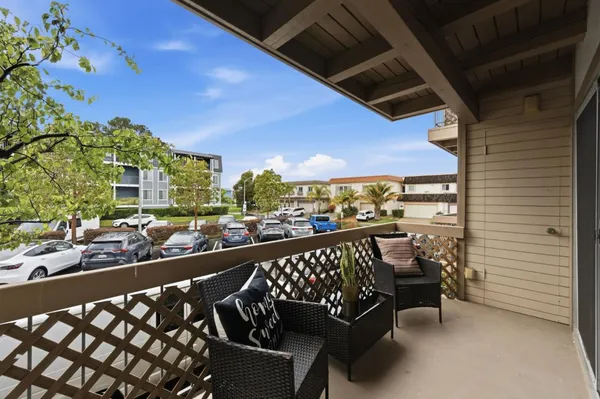 a view of balcony with furniture