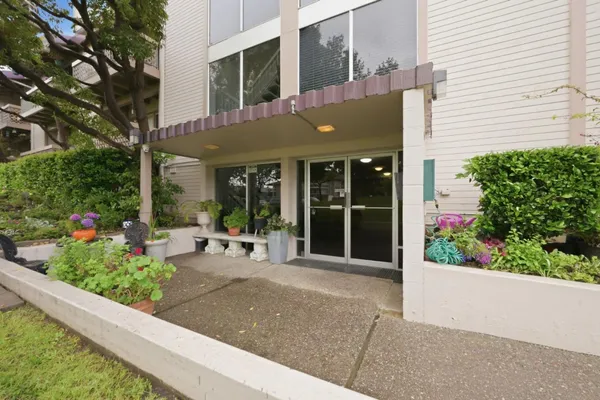 a view of a building with sitting area