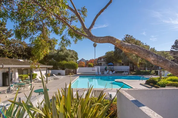 a view of a swimming pool with a patio