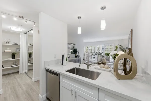 a view of a kitchen with furniture and a kitchen