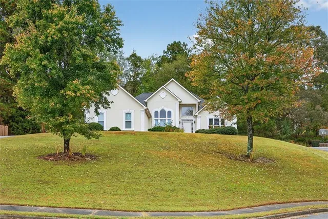 a front view of a house with a yard