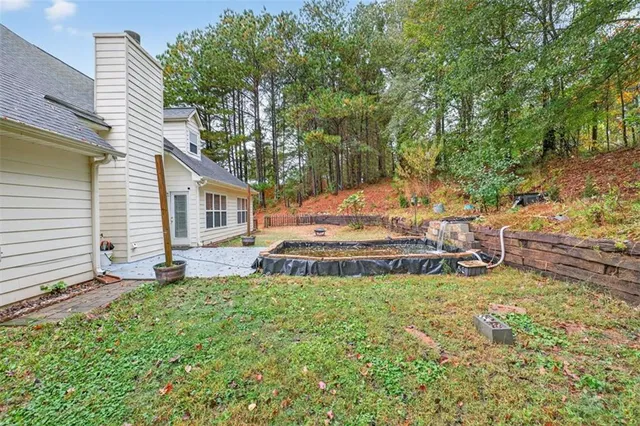 a sign that is sitting in front of flowers