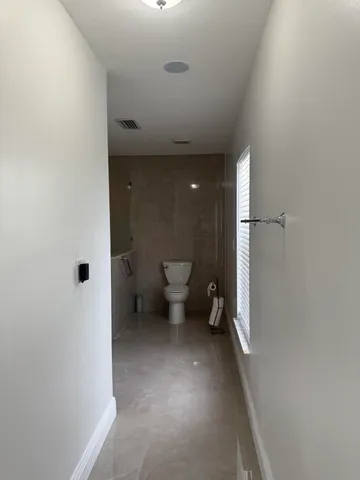 a view of a bathroom with a toilet