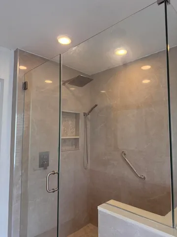 a bathroom with a shower and a shower