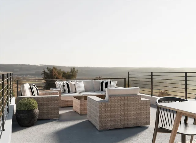 a view of roof deck with couch and chairs
