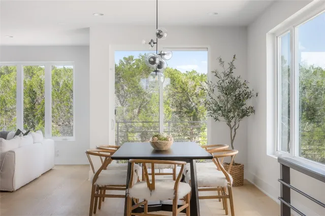 a view of a dining room with furniture window and outside view