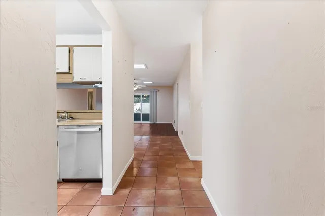 a view of a kitchen from the hallway