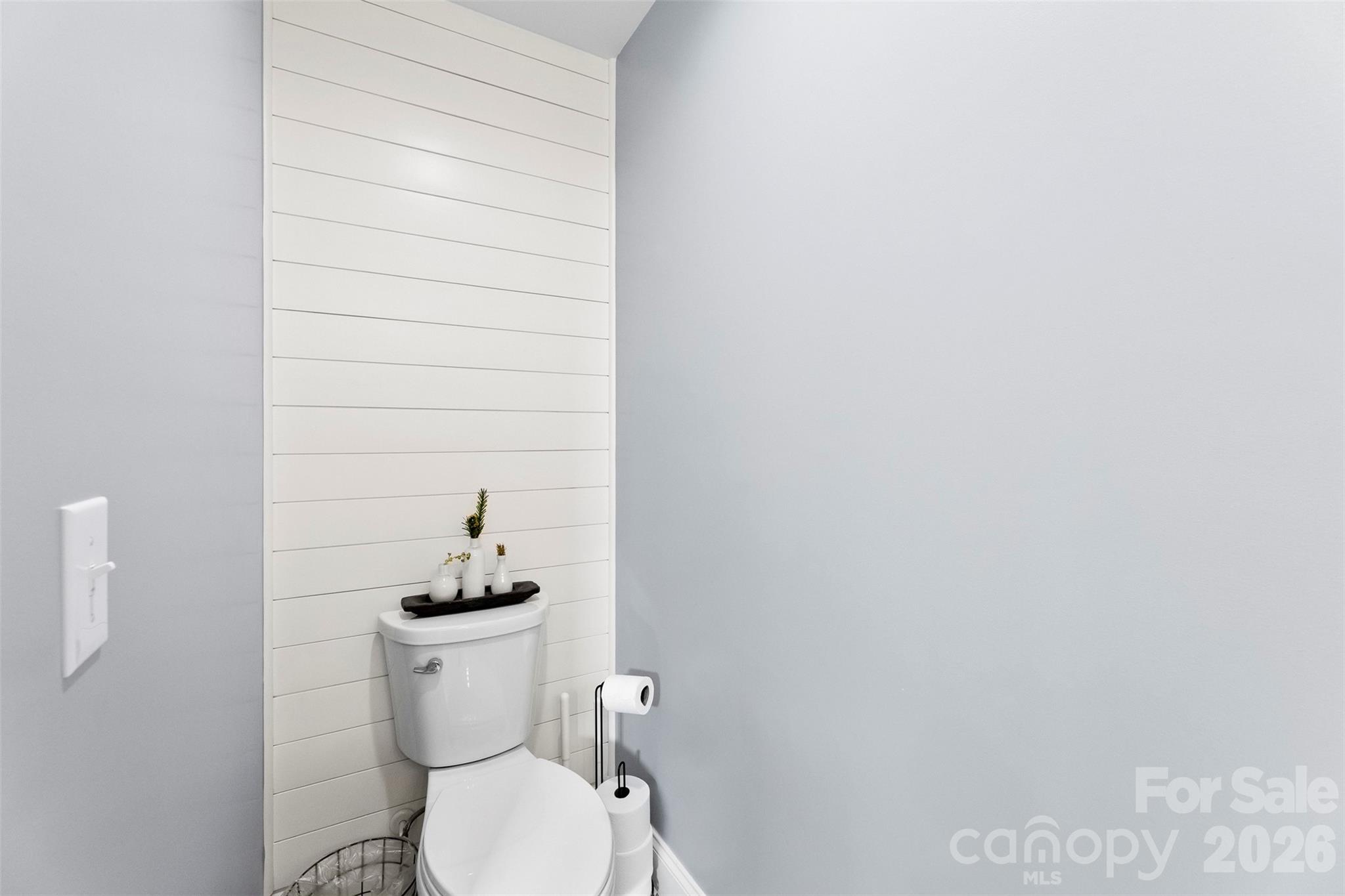 1298 Timber Spring Lane Salisbury, NC 28147 - Photo 15 of 34 a white toilet sitting next to a white wall