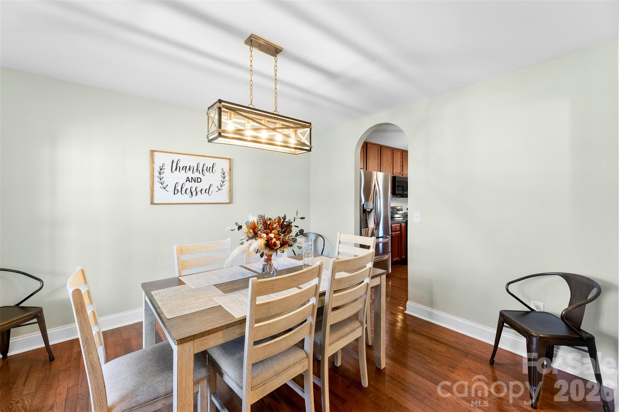 1298 Timber Spring Lane Salisbury, NC 28147 - Photo 17 of 34 a view of a dining room with furniture and wooden floor