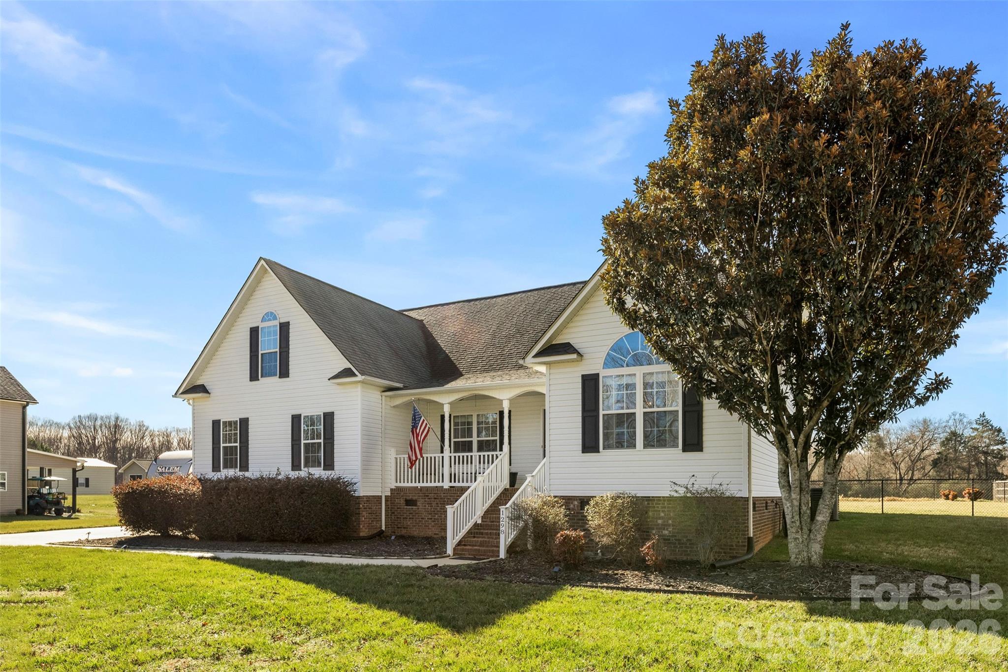 1298 Timber Spring Lane Salisbury, NC 28147 - Photo 2 of 34 a front view of a house with a yard