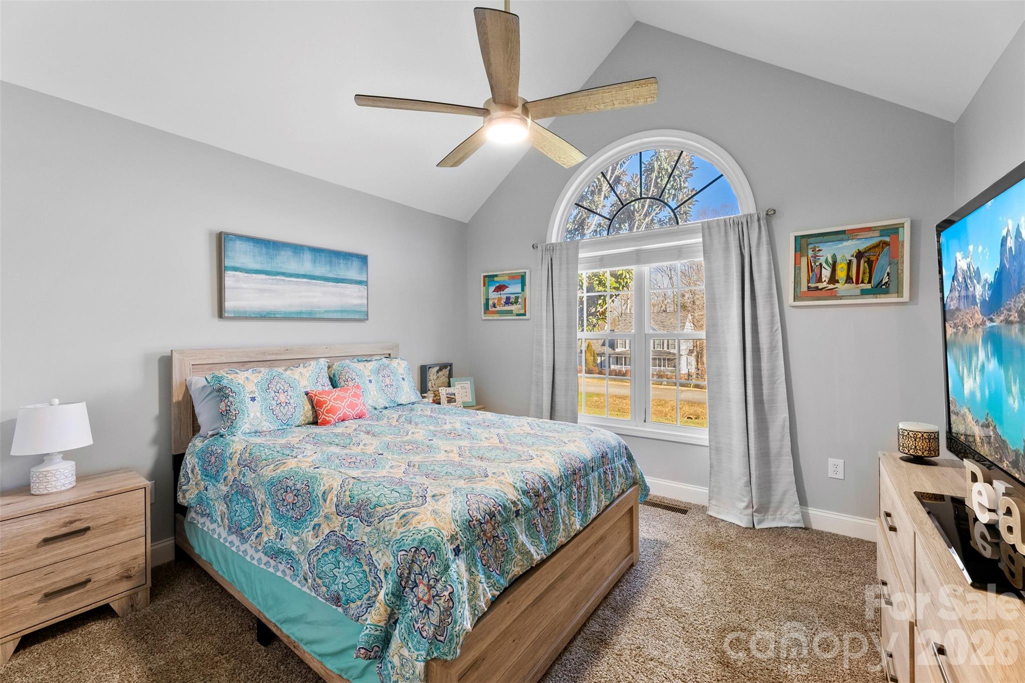 1298 Timber Spring Lane Salisbury, NC 28147 - Photo 24 of 34 a bedroom with a bed and a chandelier