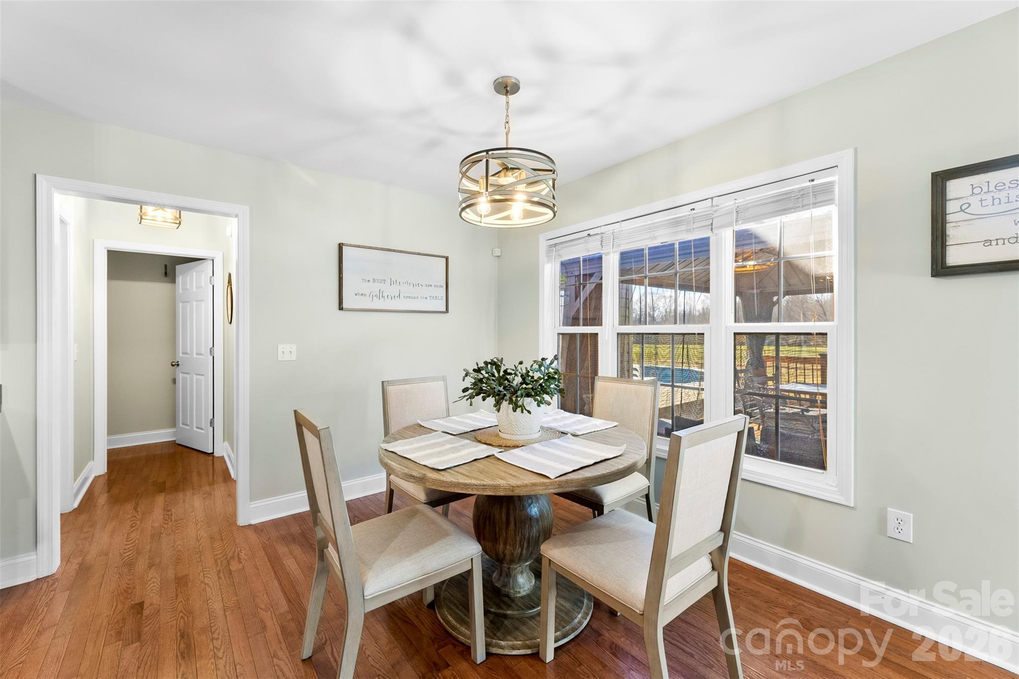 1298 Timber Spring Lane Salisbury, NC 28147 - Photo 8 of 34 a view of a dining room with a table and chairs