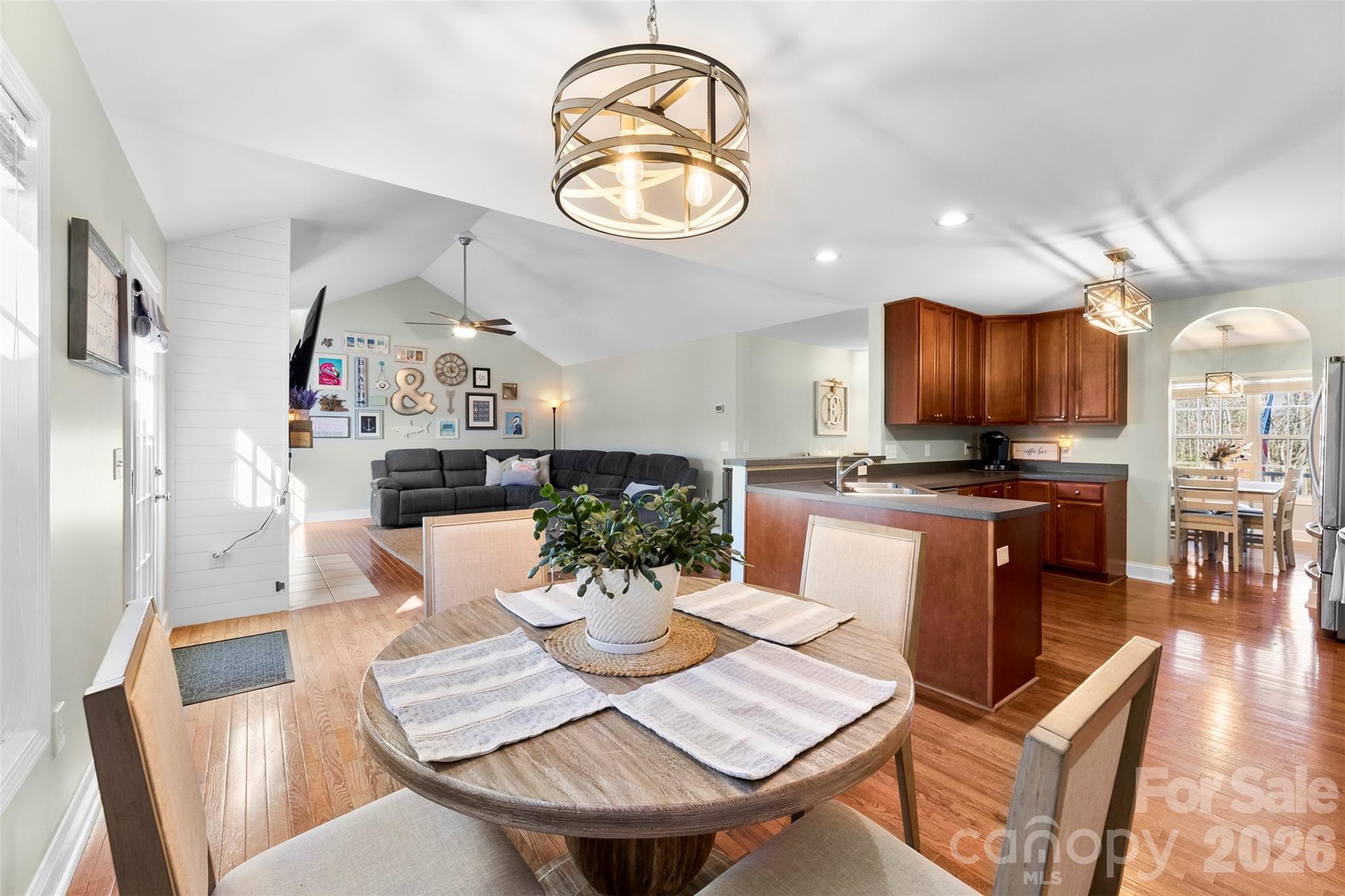 1298 Timber Spring Lane Salisbury, NC 28147 - Photo 9 of 34 a view of a dining room with furniture and a chandelier
