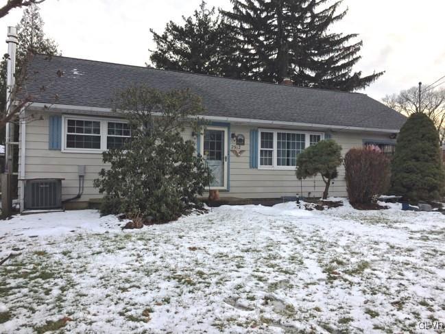 2912 Middletown Road Bethlehem, PA 18020 - Photo 1 of 17 a backyard of a house with a tree covered with snow in front of house