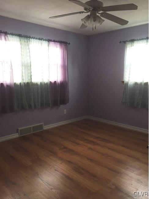 2912 Middletown Road Bethlehem, PA 18020 - Photo 4 of 17 an empty room with wooden floor and windows