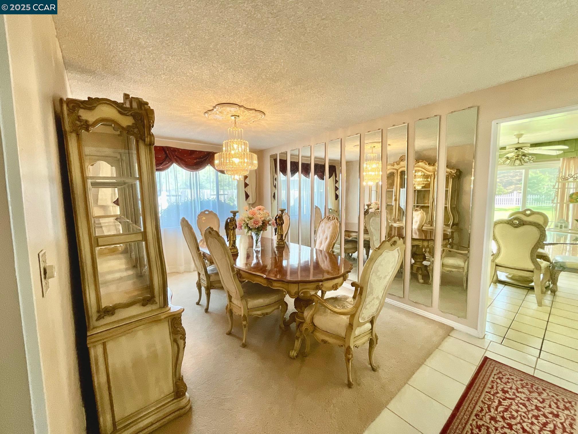 403 Gerald Court Benicia, CA 94510 - Photo 11 of 59 a dining room with furniture and a floor to ceiling window