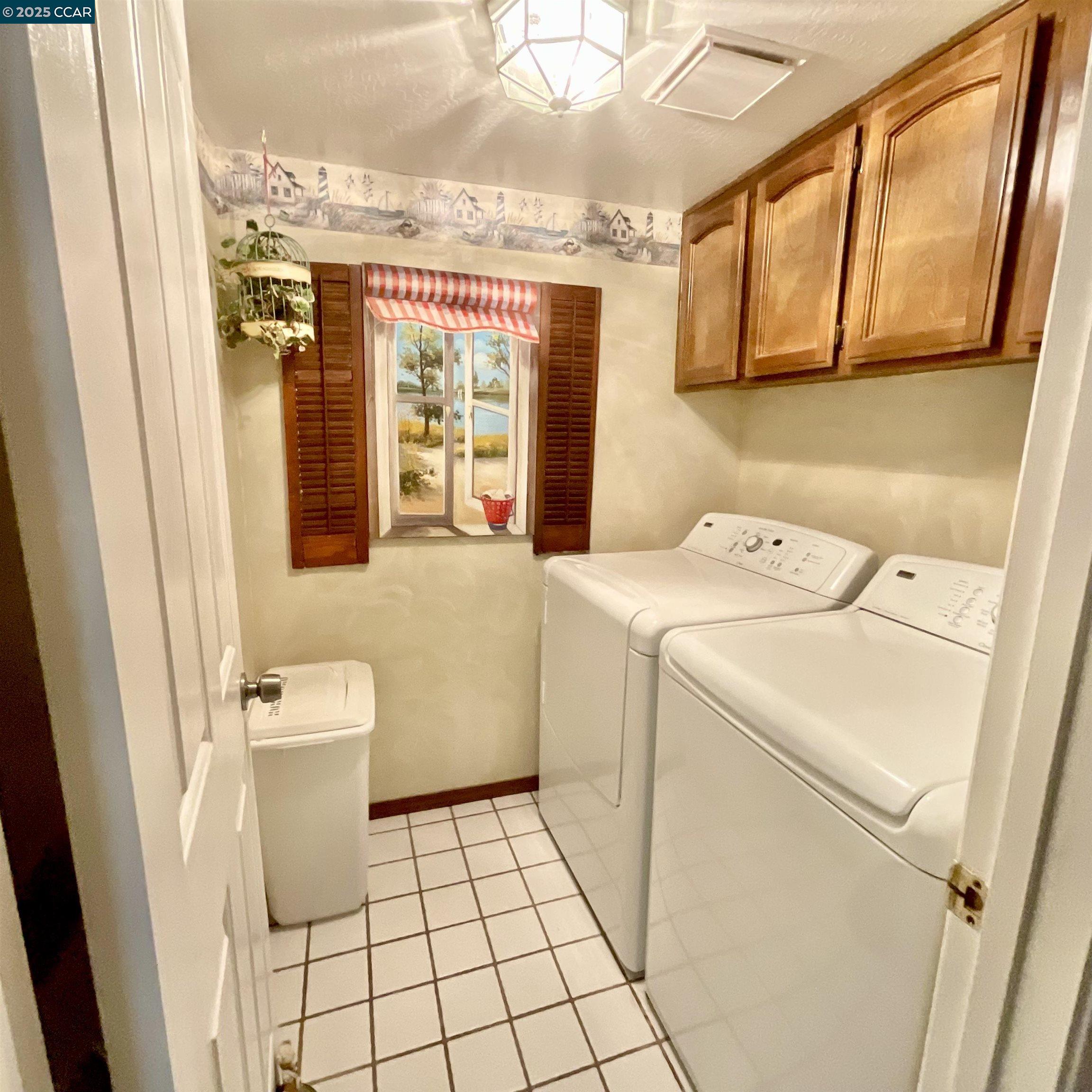 403 Gerald Court Benicia, CA 94510 - Photo 32 of 59 a bathroom with a sink a toilet and a shower curtain