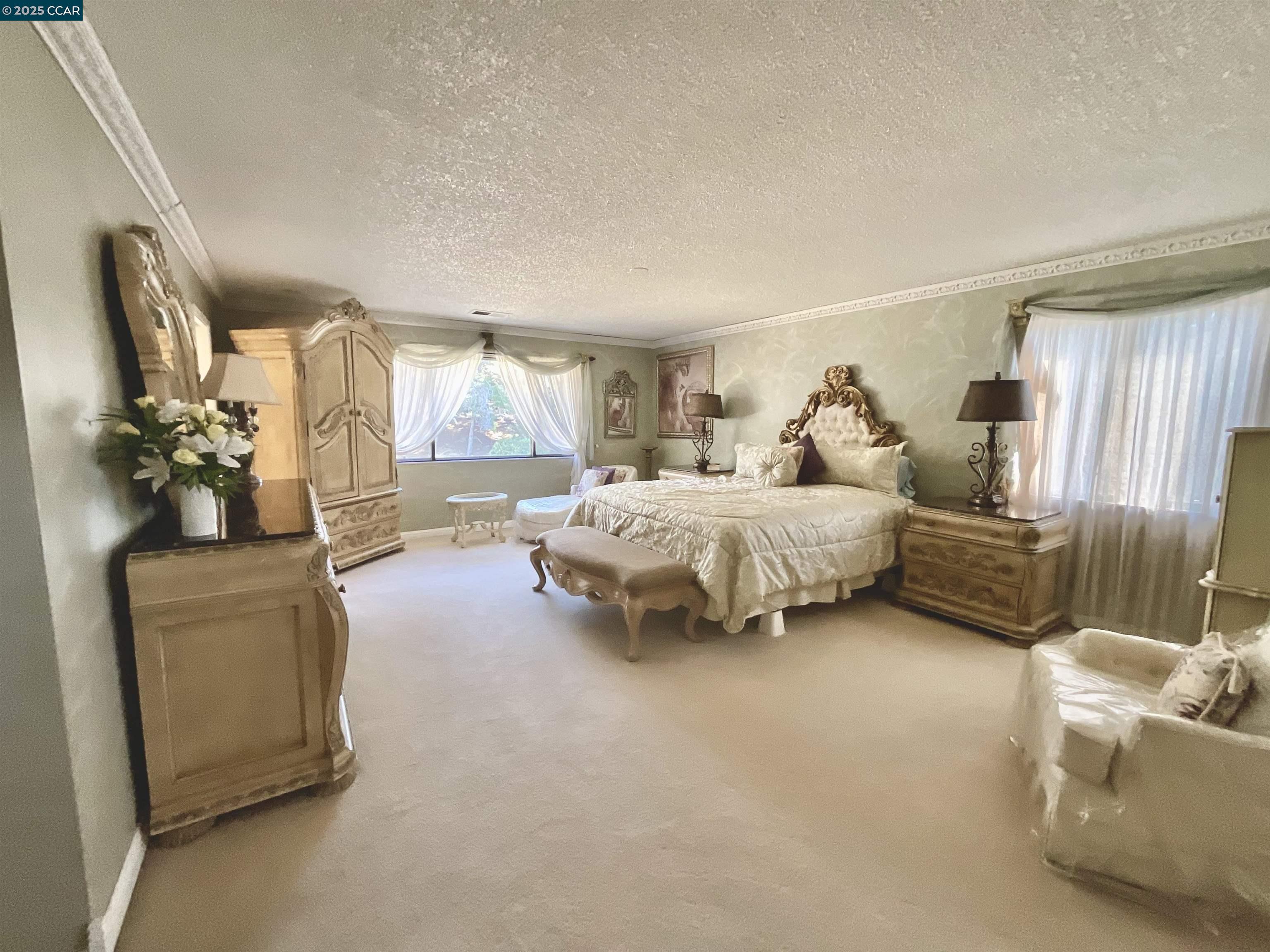 403 Gerald Court Benicia, CA 94510 - Photo 36 of 59 a spacious bedroom with a bed and a couch