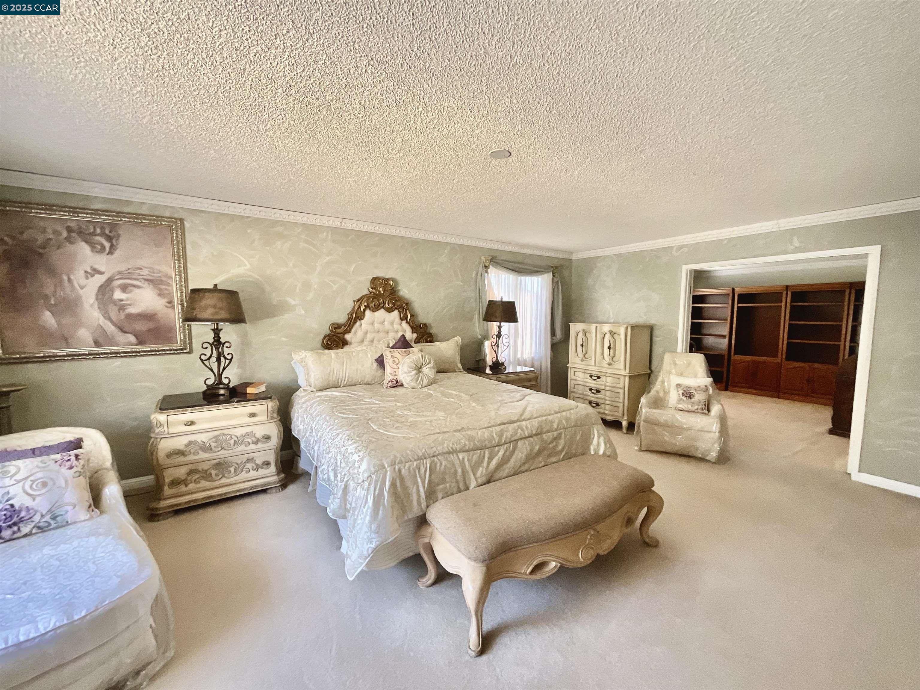 403 Gerald Court Benicia, CA 94510 - Photo 37 of 59 a spacious bedroom with a bed and couch