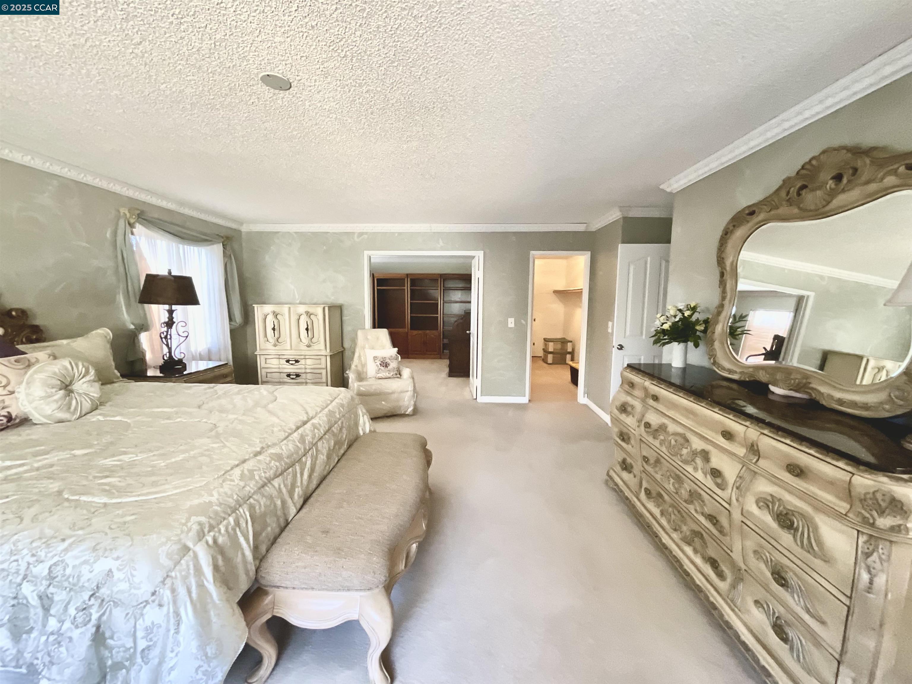 403 Gerald Court Benicia, CA 94510 - Photo 40 of 59 a spacious bedroom with a large bed and a large mirror
