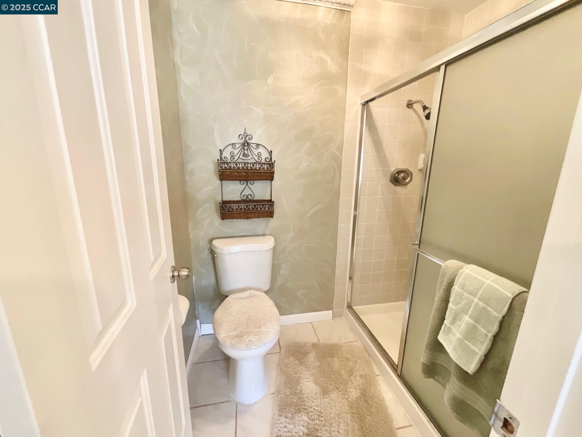 403 Gerald Court Benicia, CA 94510 - Photo 45 of 59 a bathroom with a toilet and a shower