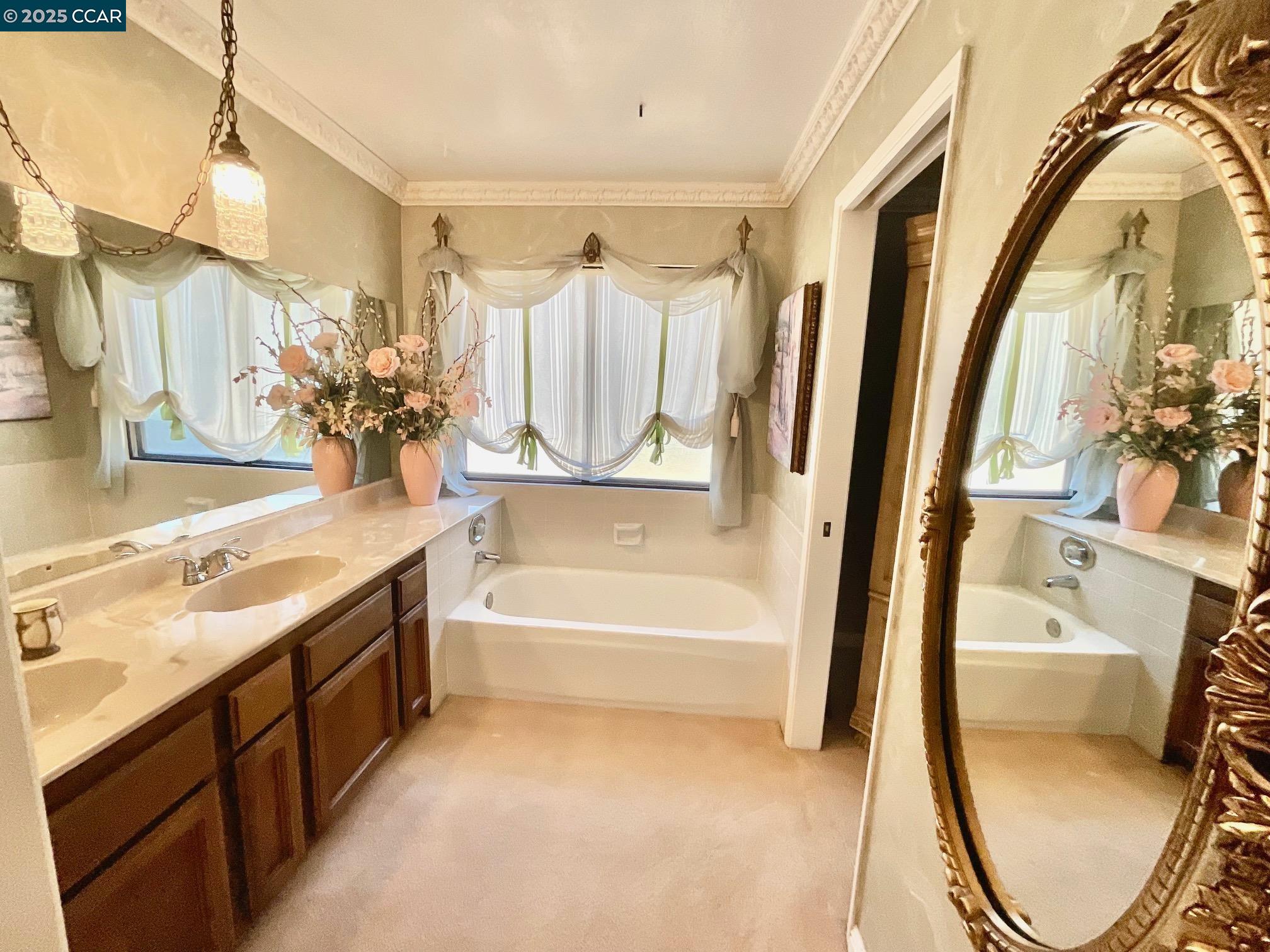 403 Gerald Court Benicia, CA 94510 - Photo 46 of 59 a bathroom with a tub sink and mirror