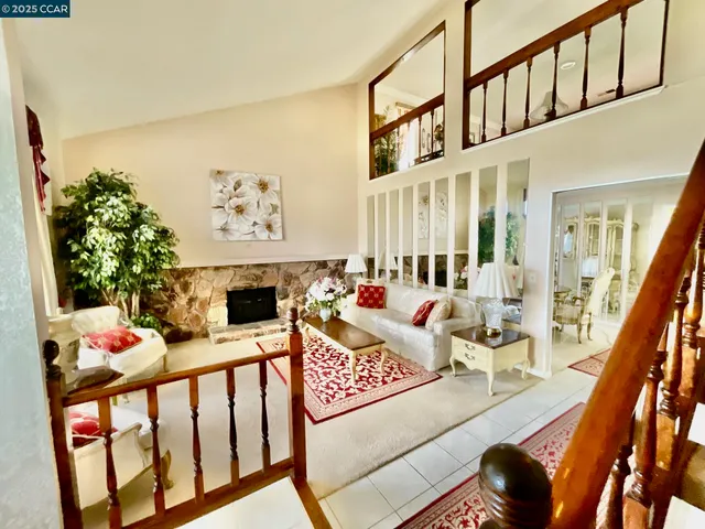 a bedroom with furniture and a large window