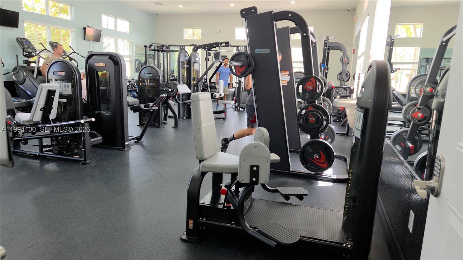 9001 Southwest 227th Street, Unit 7 Cutler Bay, FL 33190 - Photo 12 of 13 a view of a room with gym equipment