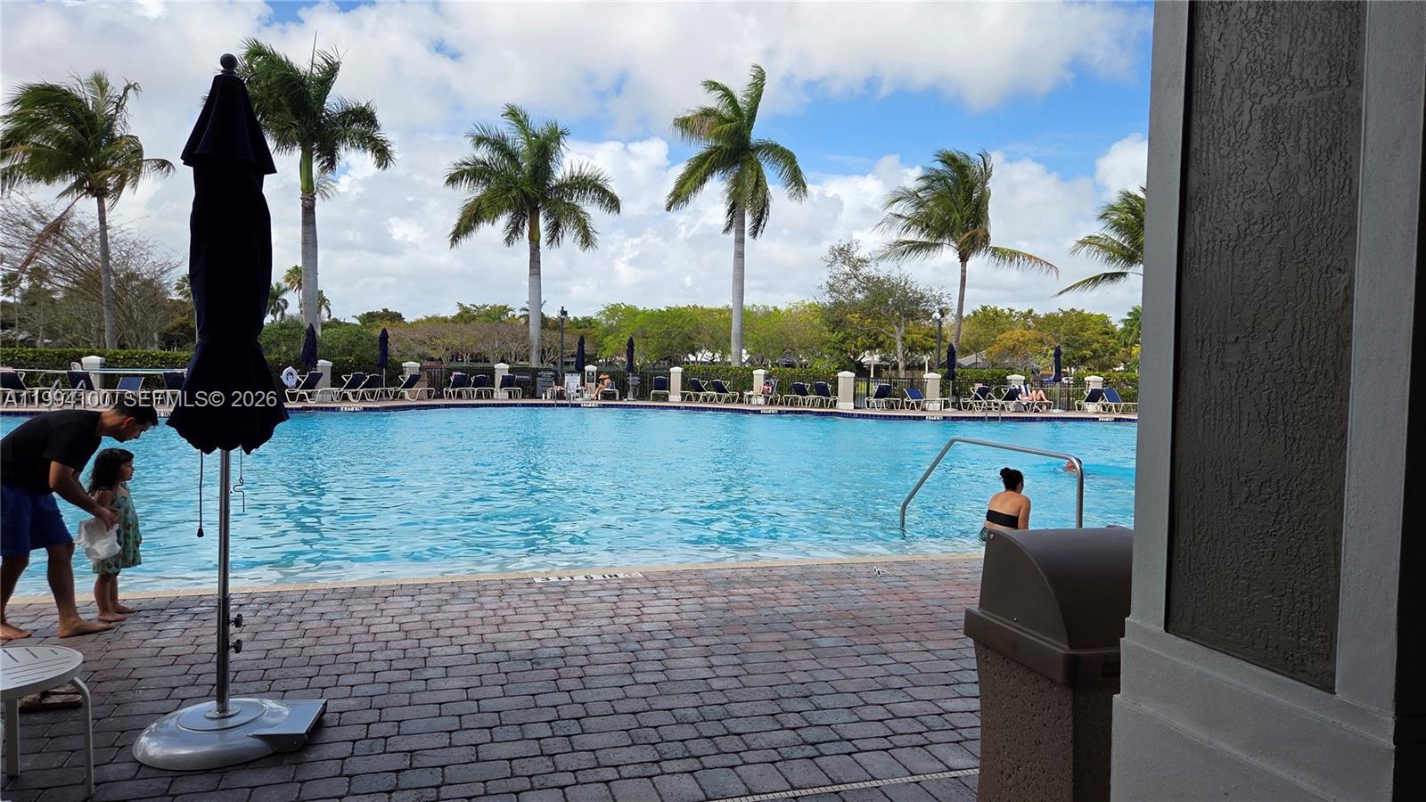9001 Southwest 227th Street, Unit 7 Cutler Bay, FL 33190 - Photo 13 of 13 a view of a lake with a palm trees