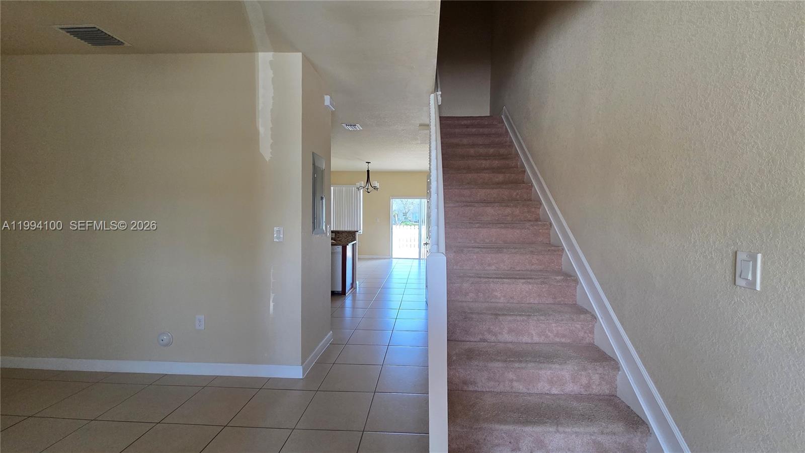 9001 Southwest 227th Street, Unit 7 Cutler Bay, FL 33190 - Photo 2 of 13 a view of entryway and hall with wooden floor