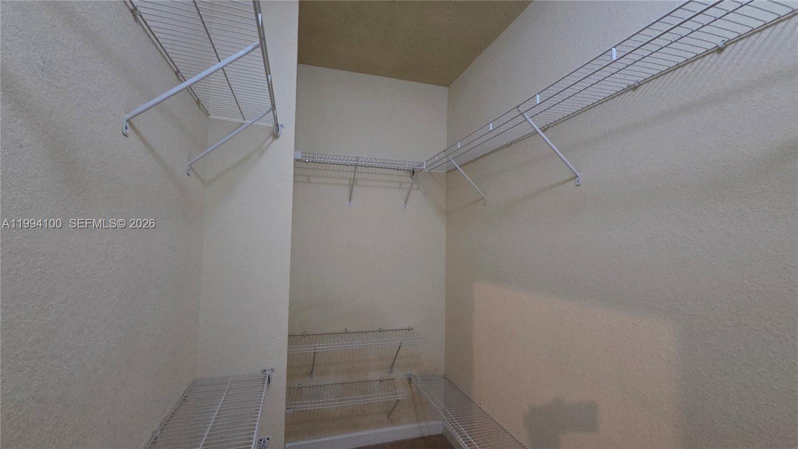 9001 Southwest 227th Street, Unit 7 Cutler Bay, FL 33190 - Photo 7 of 13 a view of walk in closet