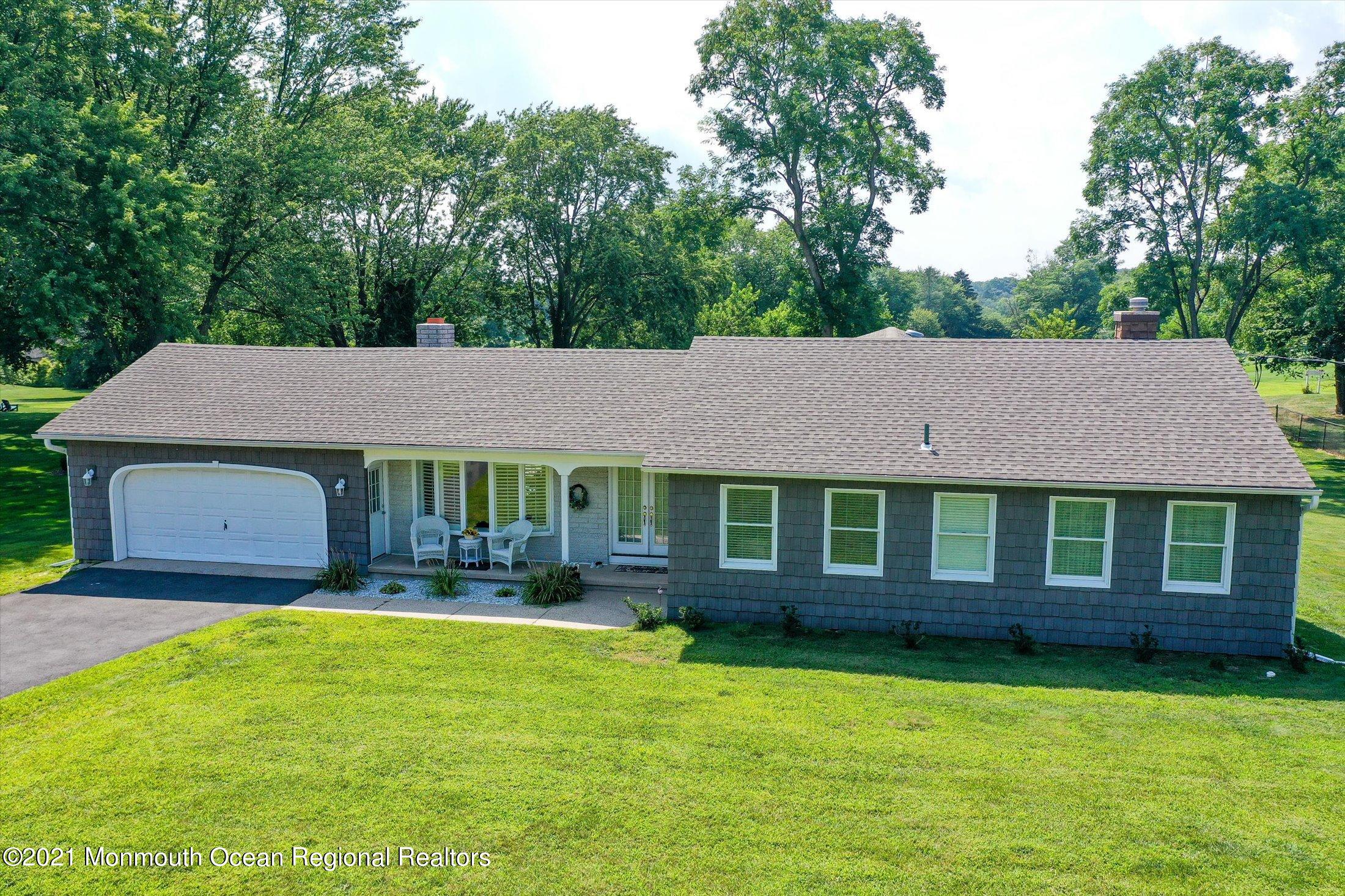 1995 Campbell Road Belmar, NJ 07719 - Photo 2 of 46 a front view of a house with a yard
