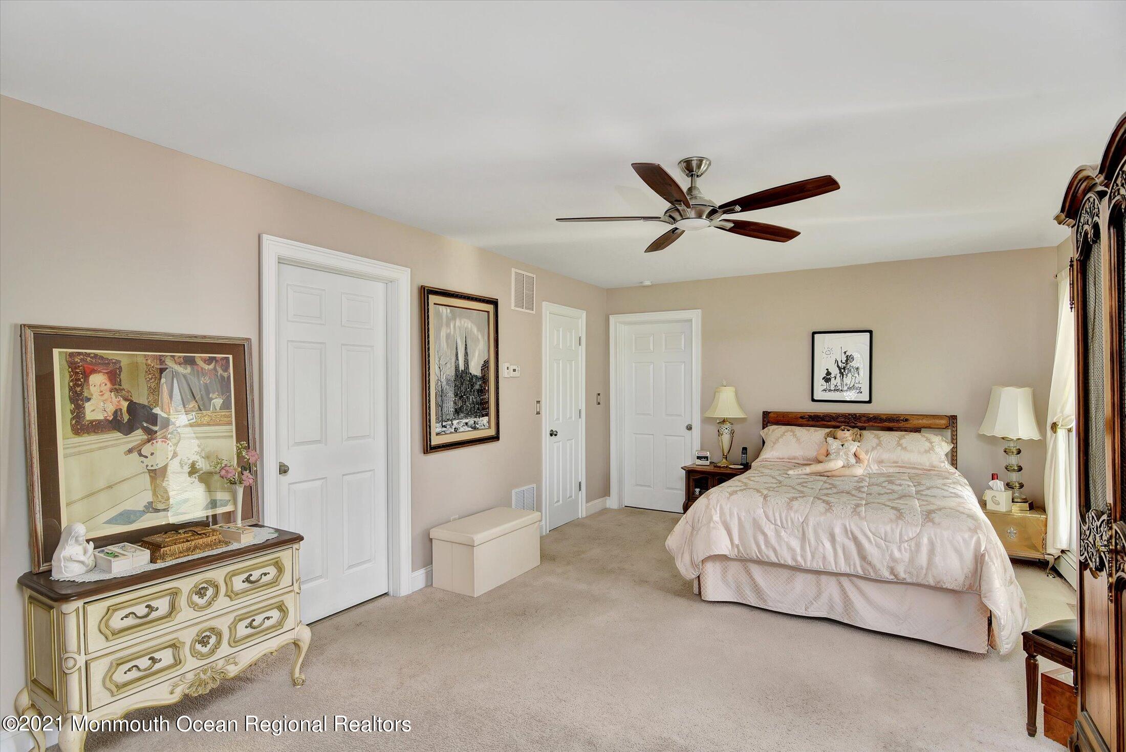 1995 Campbell Road Belmar, NJ 07719 - Photo 18 of 46 a bedroom with a bed and ceiling fan