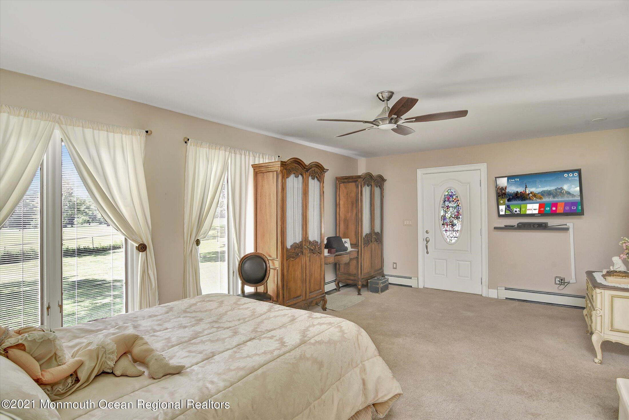 1995 Campbell Road Belmar, NJ 07719 - Photo 19 of 46 a bed room with a bed and a television