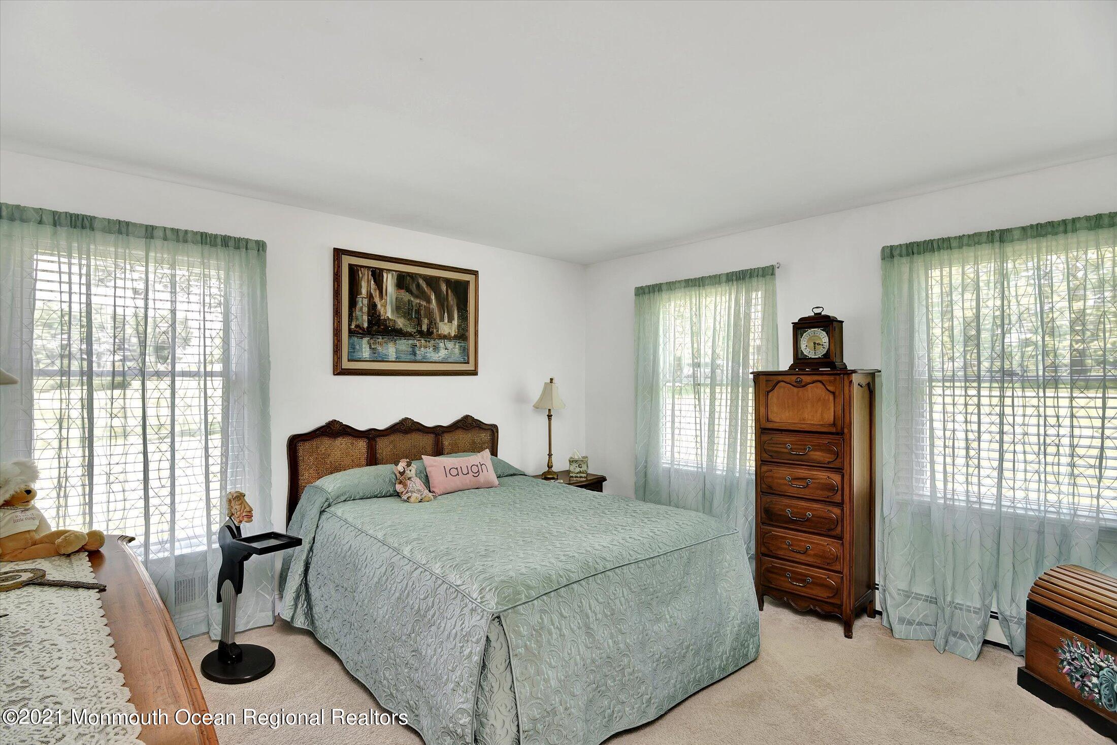 1995 Campbell Road Belmar, NJ 07719 - Photo 25 of 46 a bedroom with a bed and a dresser next to a window