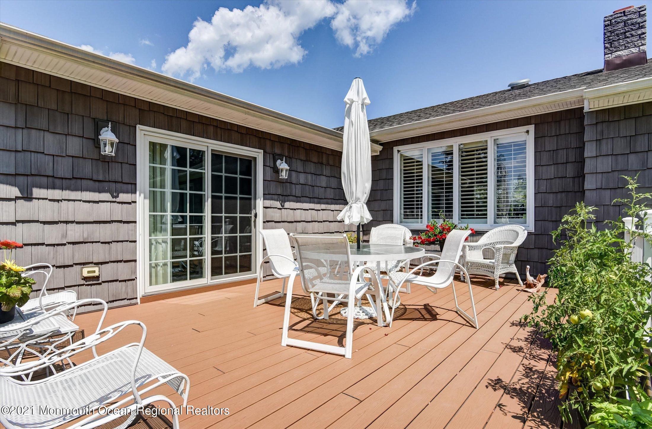 1995 Campbell Road Belmar, NJ 07719 - Photo 34 of 46 a view of a patio with table and chairs