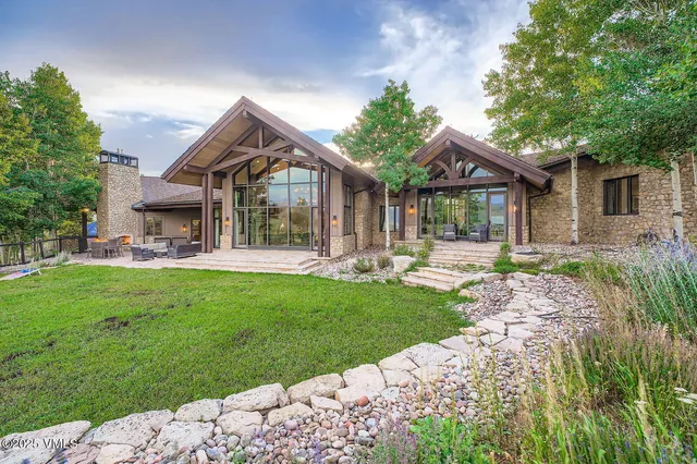 a front view of house with yard and green space