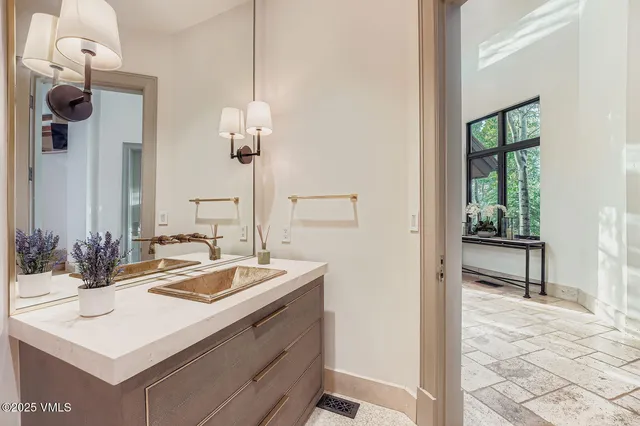 a bathroom with a sink and a mirror