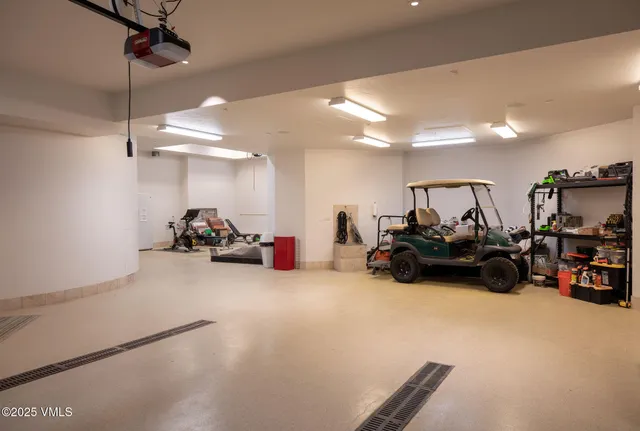 a view of a garage with cars