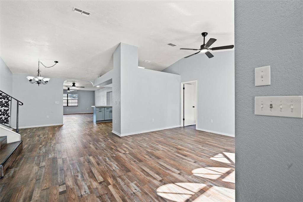 11215 Addison Street Spring Hill, FL 34609 - Photo 27 of 51 a view of empty room with wooden floor and ceiling fan