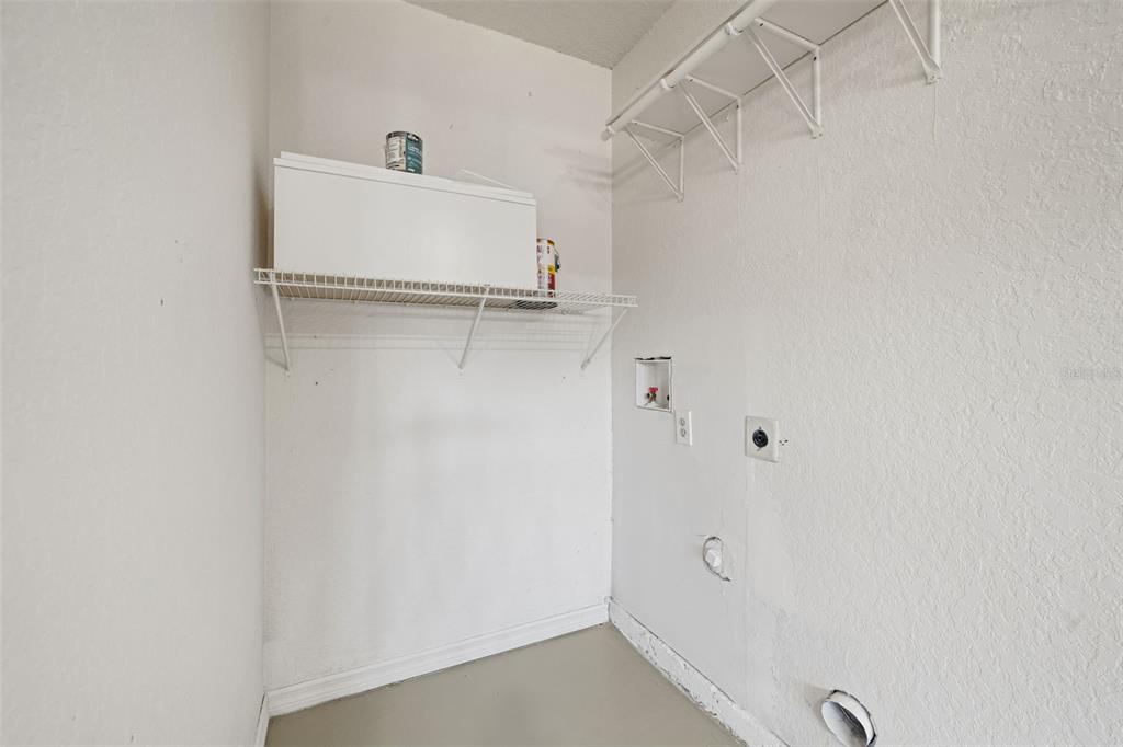 11215 Addison Street Spring Hill, FL 34609 - Photo 36 of 51 a white bath tub sitting next to a white sink