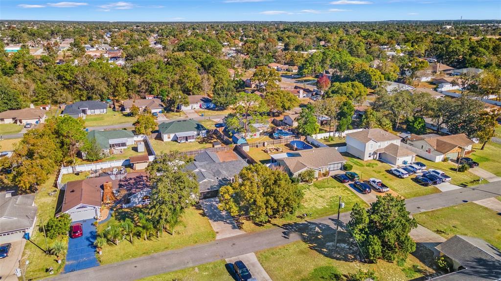 11215 Addison Street Spring Hill, FL 34609 - Photo 46 of 51 an aerial view of residential houses with outdoor space