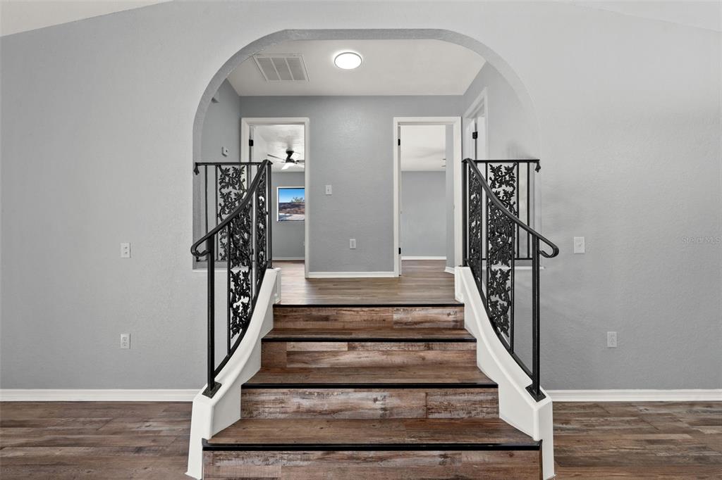 11215 Addison Street Spring Hill, FL 34609 - Photo 5 of 51 a view of entryway and hall with wooden floor