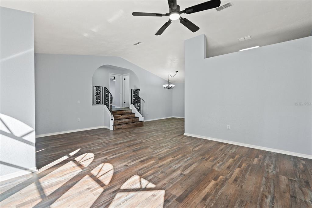 11215 Addison Street Spring Hill, FL 34609 - Photo 7 of 51 a view of a livingroom with wooden floor
