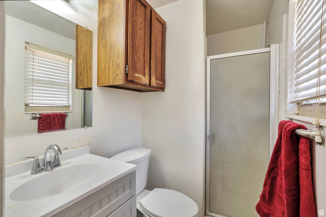 1057 North 700 West Clinton, UT 84015 - Photo 6 of 15 Full bath with vanity and a shower stall