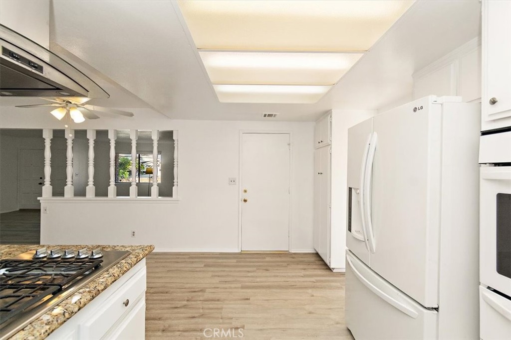 1330 La Serena Drive Glendora, CA 91740 - Photo 16 of 36 a kitchen with granite countertop a sink cabinets and a stove