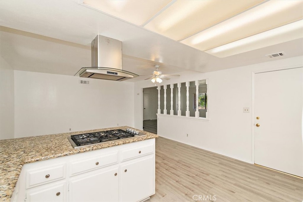 1330 La Serena Drive Glendora, CA 91740 - Photo 17 of 36 a kitchen with granite countertop a stove and a sink