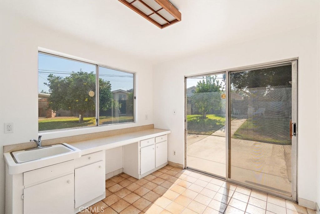 1330 La Serena Drive Glendora, CA 91740 - Photo 18 of 36 a view of a kitchen with a sink and dishwasher with a floor to ceiling window