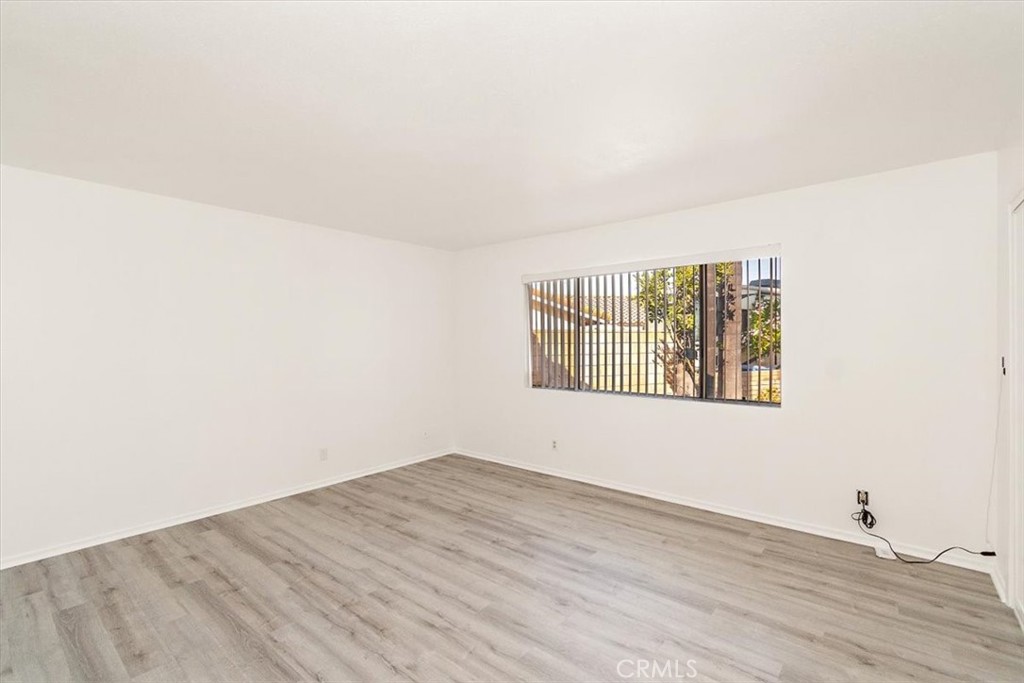 1330 La Serena Drive Glendora, CA 91740 - Photo 19 of 36 a view of an empty room with wooden floor and a window